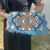 Pochette femme œil bleu