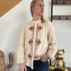 blouse en coton beige avec broderies terracotta