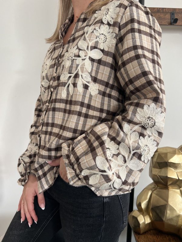 Blouse à carreaux avec broderie